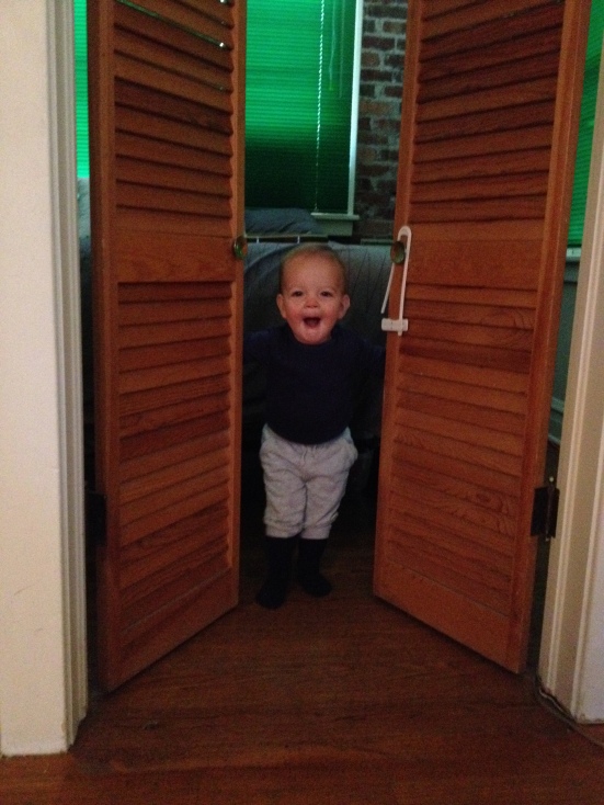 Peek-a-boo never fails to entertain. Please note the baby-proofing lock hanging from the door knob. Ace doesn't take too well to being kept out of a room. 